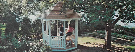 Gazebo in a garden by a pond