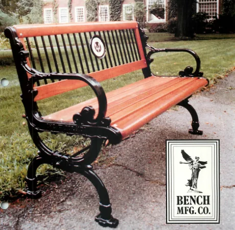 Ladderback bench in front of a university dorm